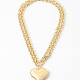 A double gold chain necklace with a gold Puffy heart pendant.