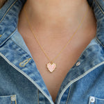 Dainty gold chain necklace with a pink enamel heart pendant