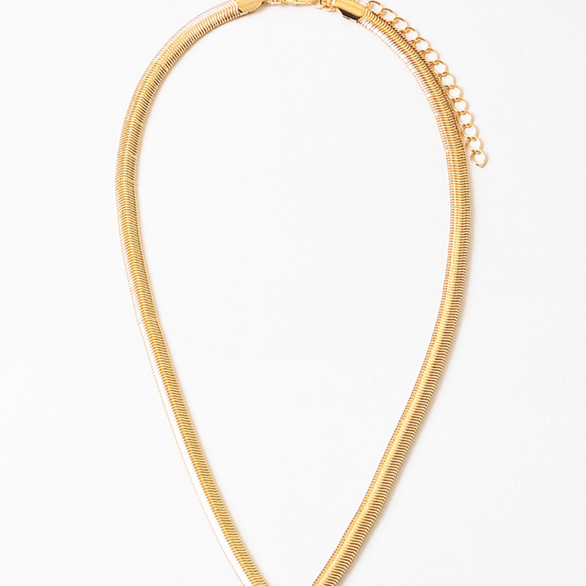 Gold chain necklace on a white background