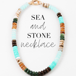Multicolored blue and brown necklace with multicolored beads on a white background, labeled 'Sea and Stone Necklace'.