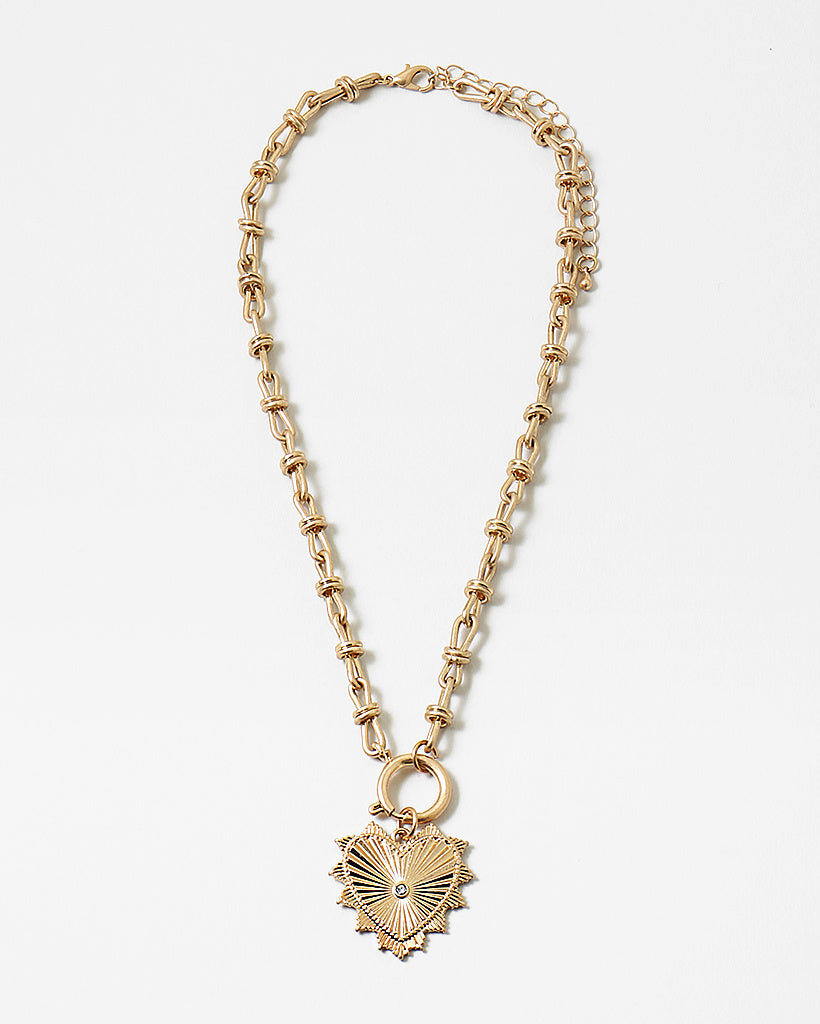 Picture of gold toggle chain with a large gold heart pendant with a diamond at its center.