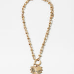Picture of gold toggle chain with a large gold heart pendant with a diamond at its center.