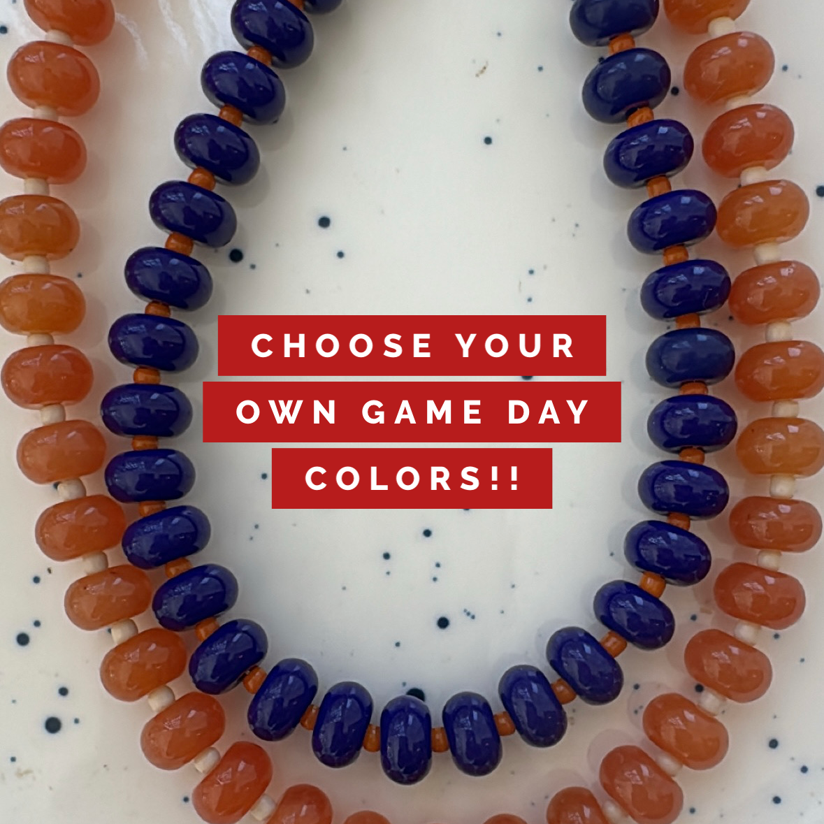 Necklaces with blue and orange beads on a white background with text 'Choose Your Own Game Day Colors!!'.