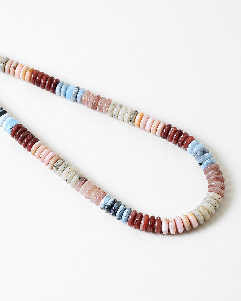 Necklace with multicolored beads on a white background