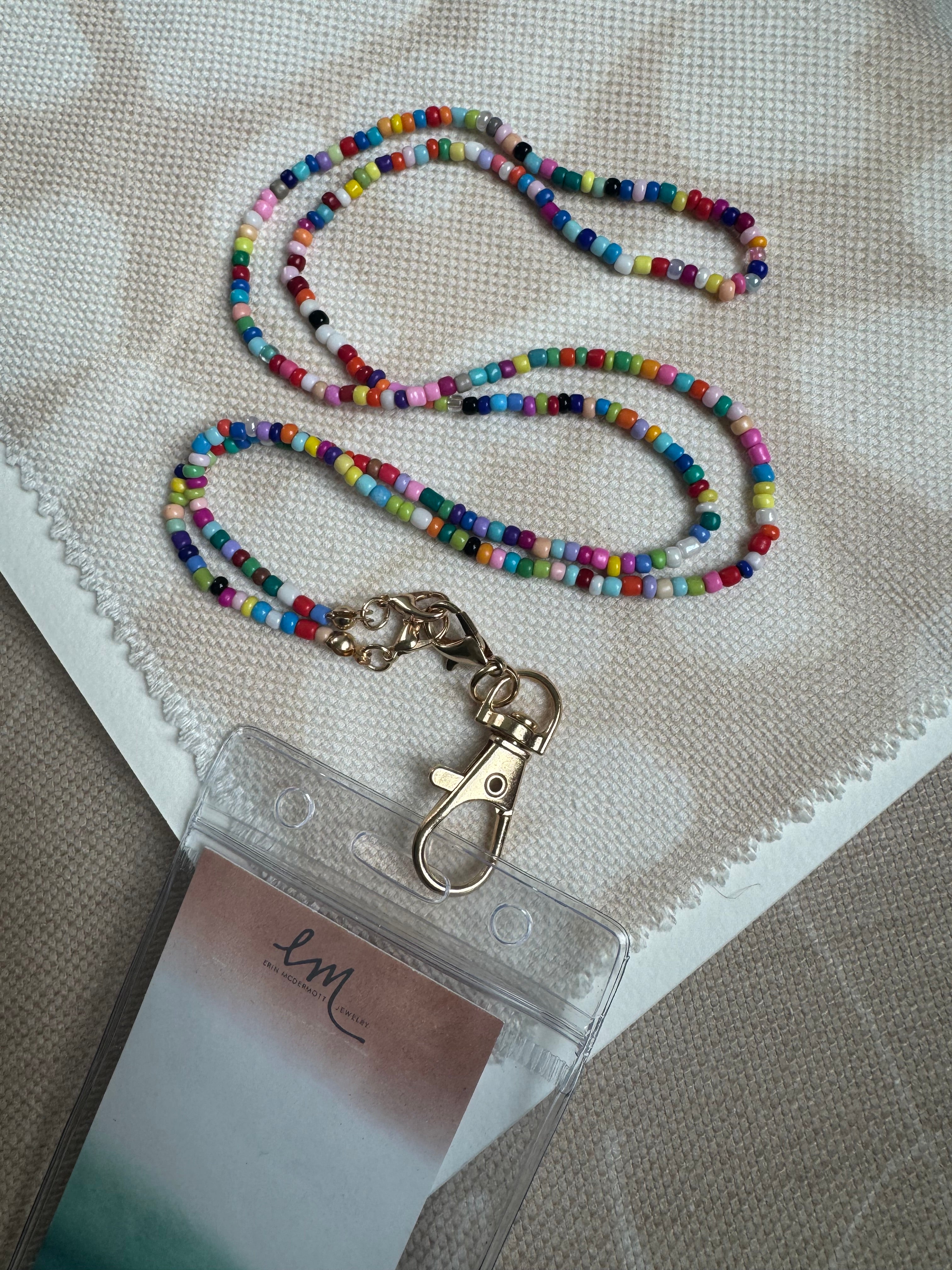 Picture of a multicolored beaded lanyard attached to a tag holder.