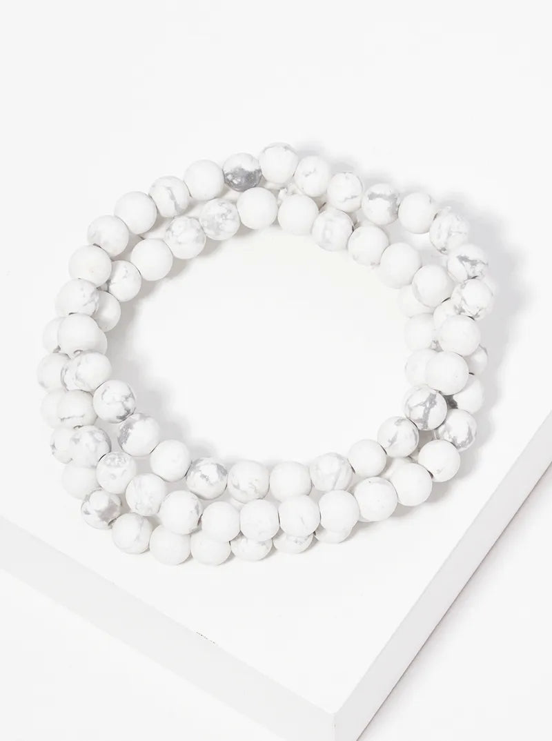 Set of three marble bead strands.