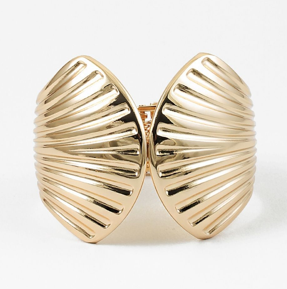 Gold shell-shaped cuff bracelets on a white background
