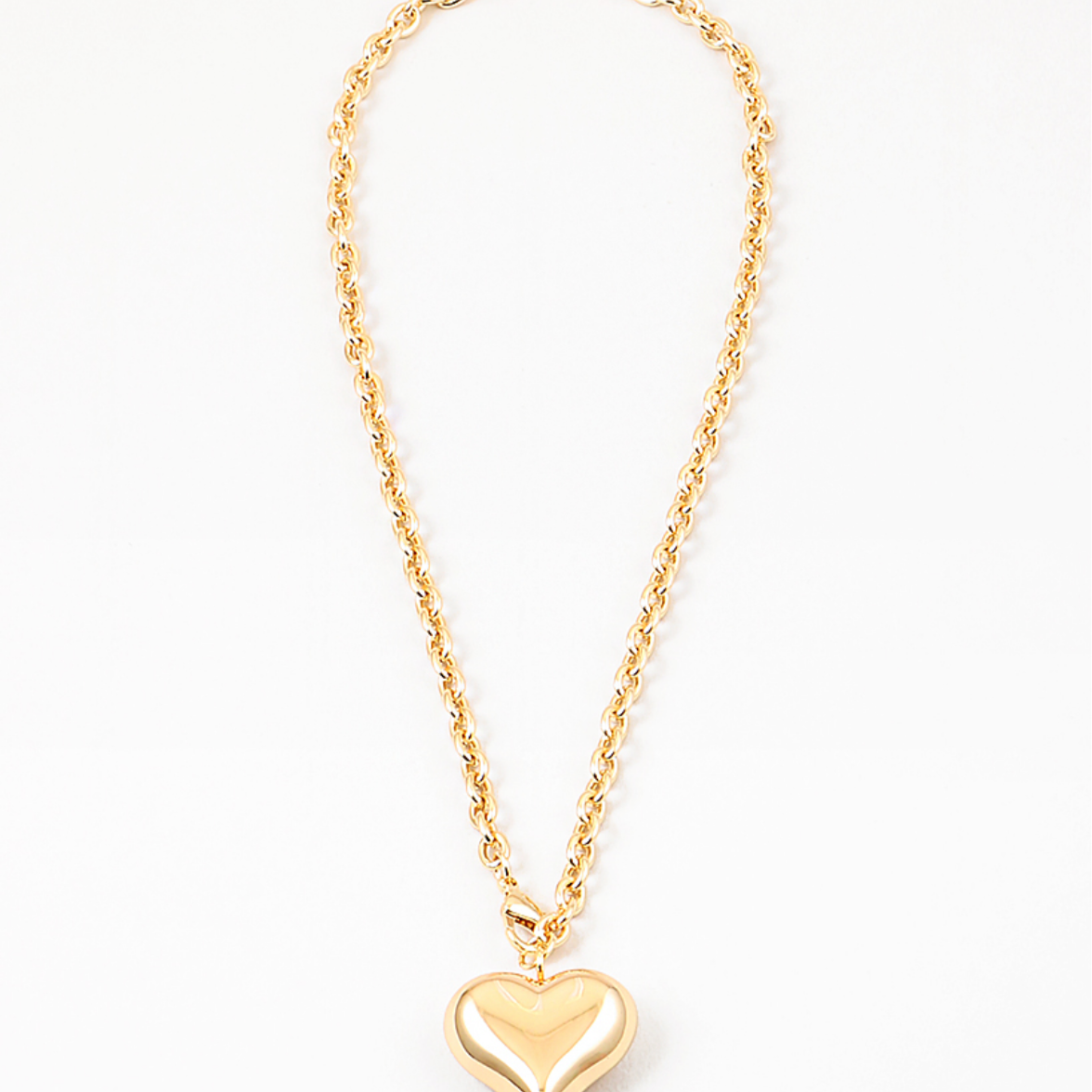 Twisted gold chain with large gold bubble heart pendant.