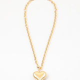 Twisted gold chain with large gold bubble heart pendant.