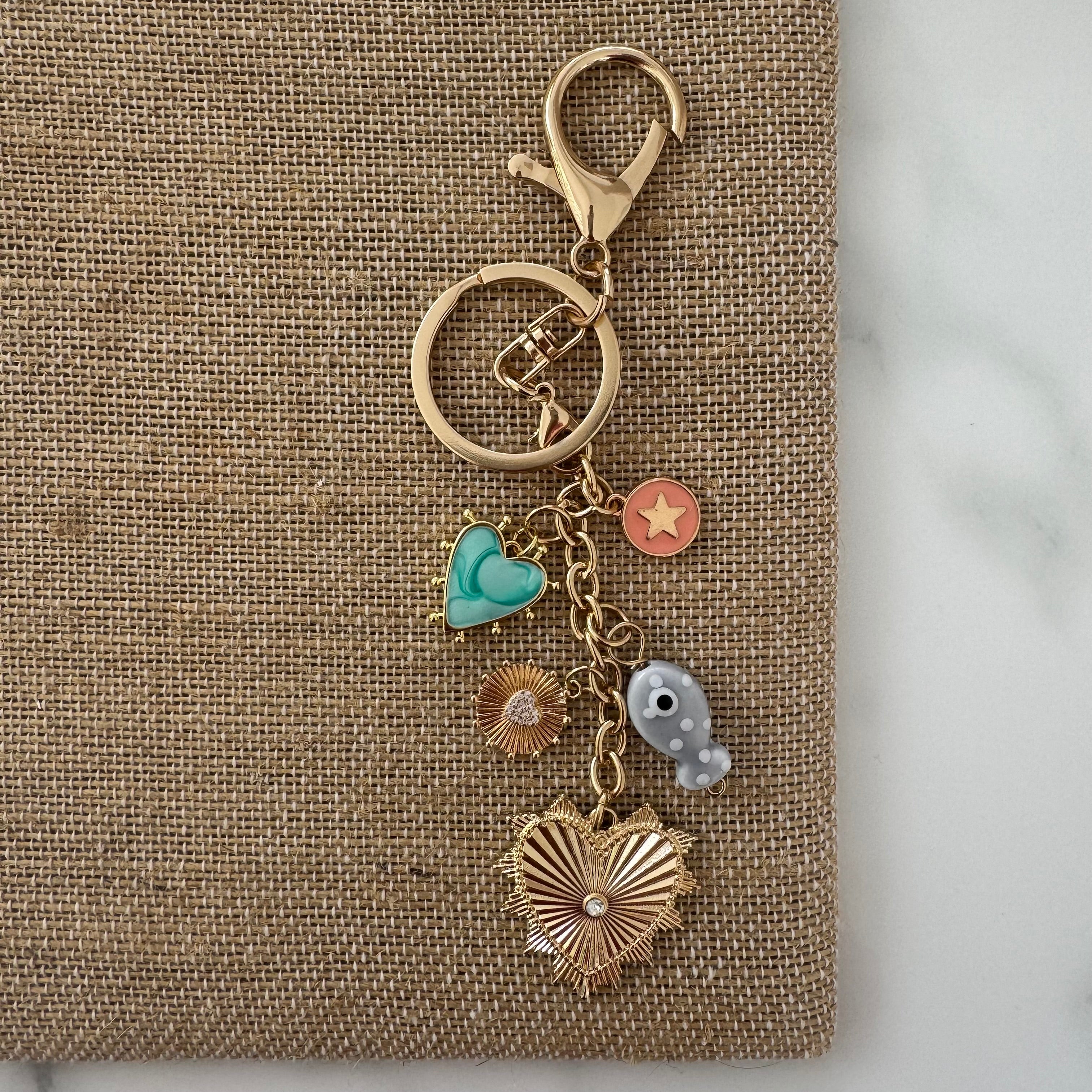 Keychain with various charms on a textured surface