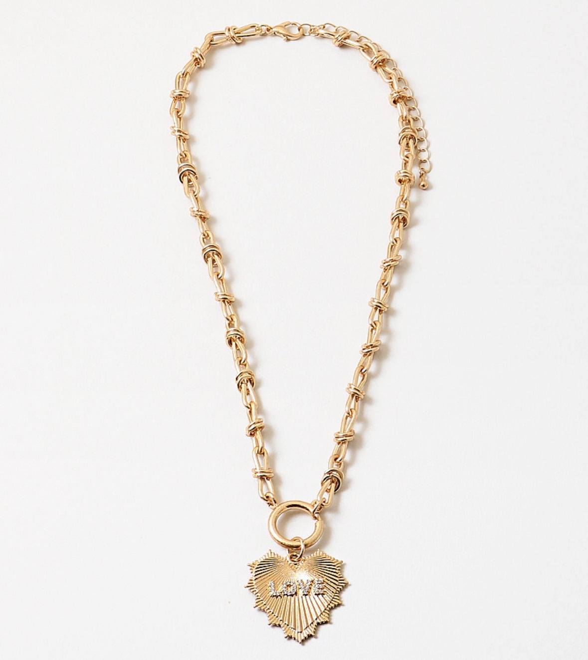 Gold chain toggle necklace with a gold heart medallion that says Love on it