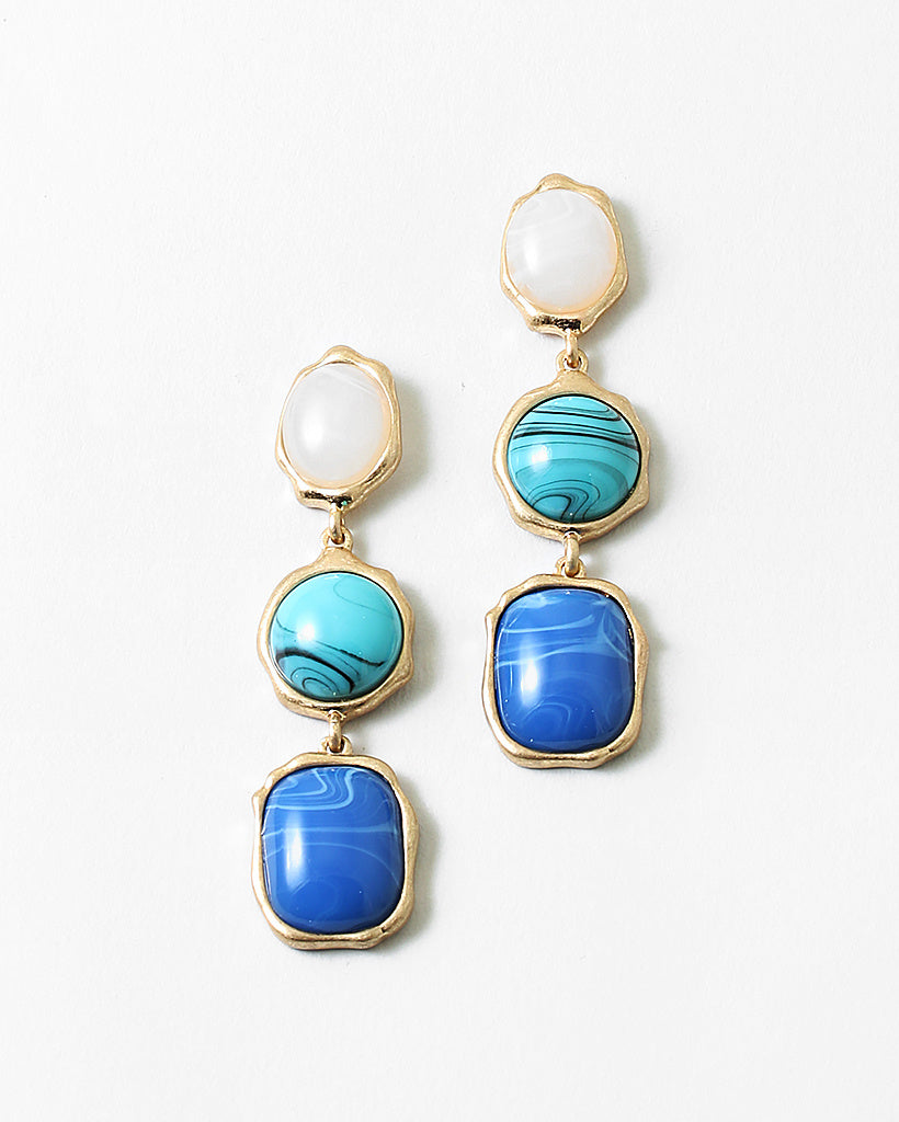Set of three dangle earrings in gold with white, turquoise and blue stones.