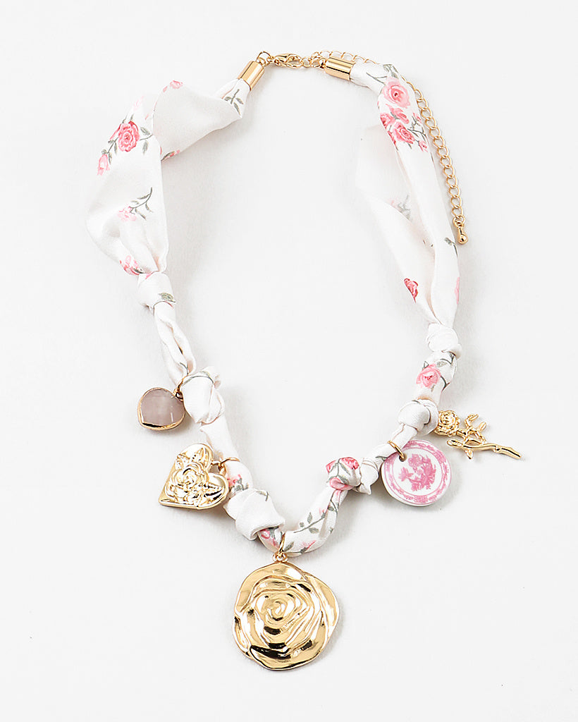 Decorative scarf necklace with floral and heart charms on a white background