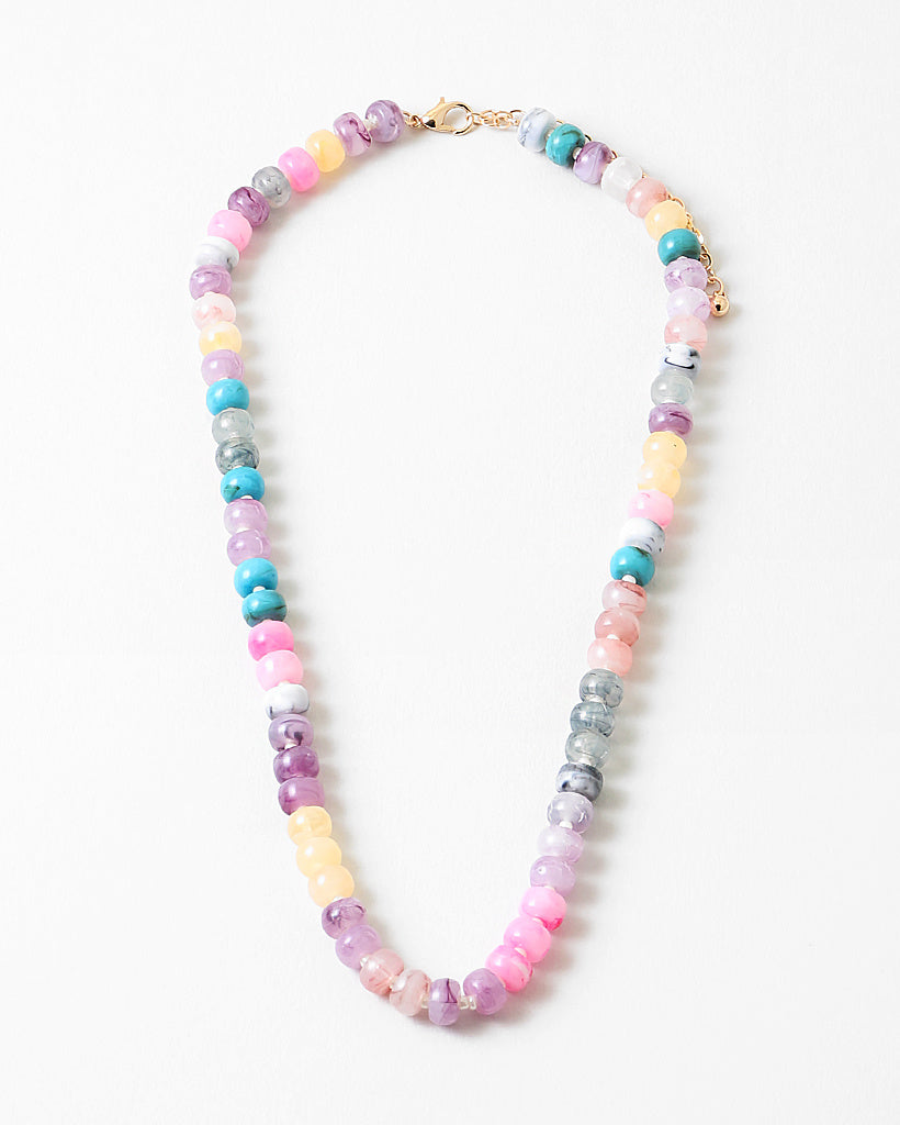 Resin bead necklace in pinks, purples and creams.