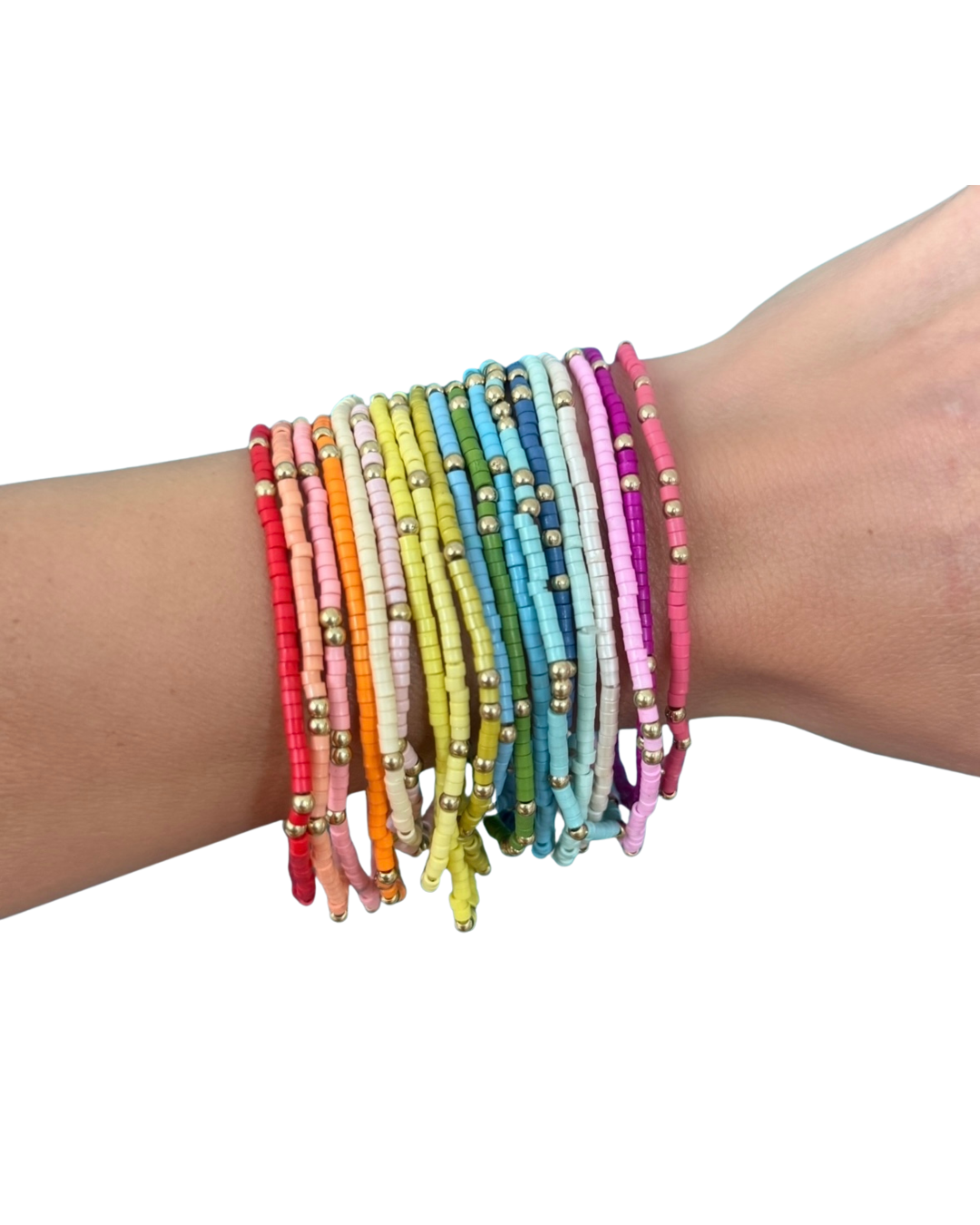 Multicolored beaded bracelets on a wrist against a white background