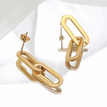Gold chain-style earrings on a white background