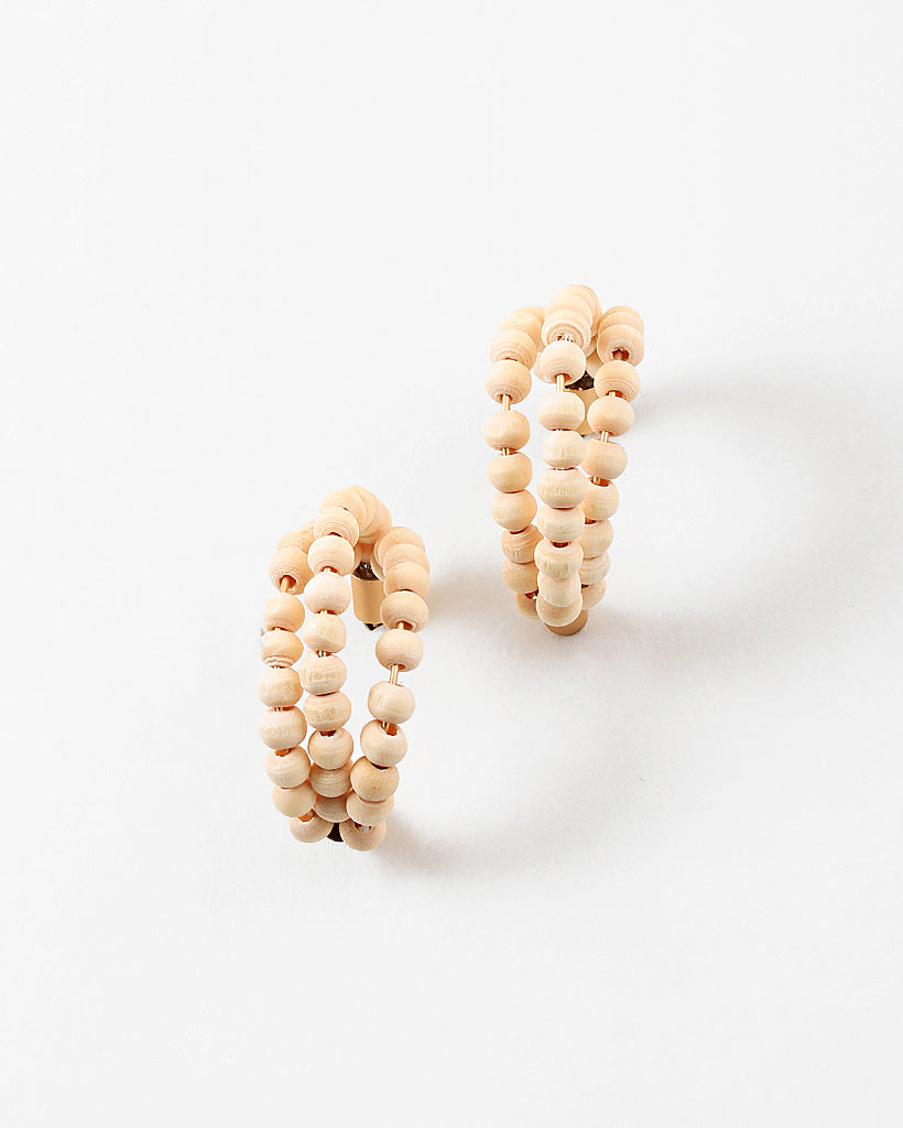 Picture of a three strand hoop earrings threaded through small wooden beads.
