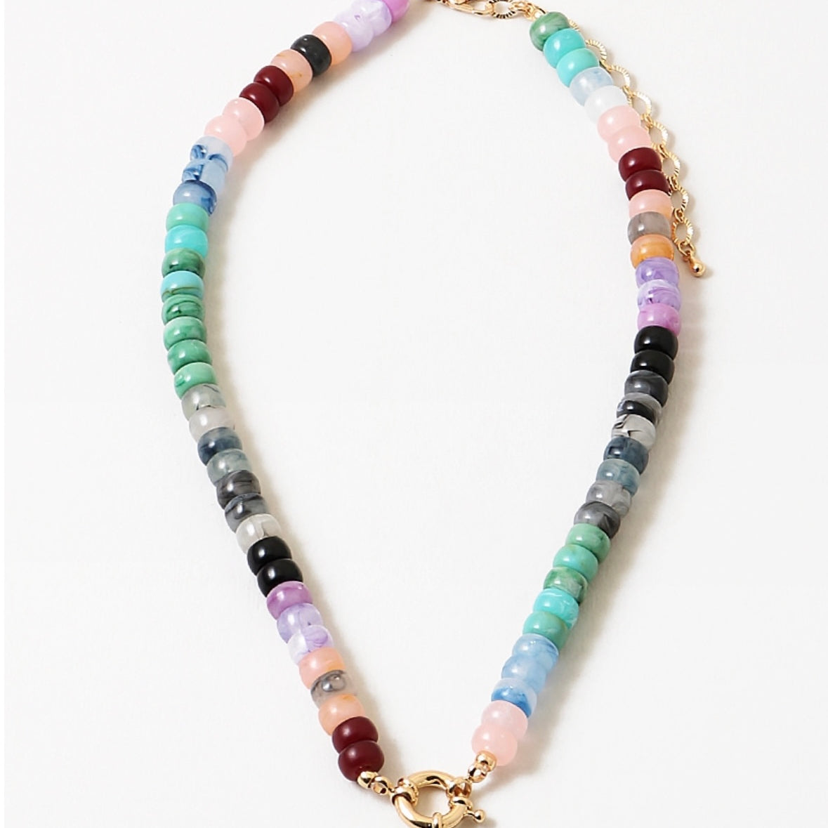 A necklace with a variety of colored beads and a gold-tone toggle clasp.