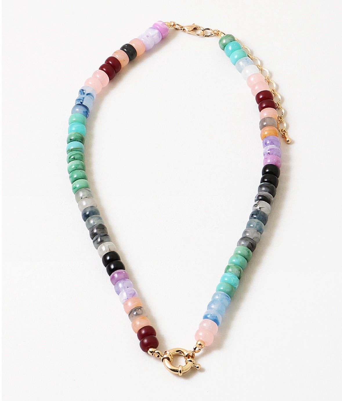 A necklace with a variety of colored beads and a gold-tone toggle clasp.
