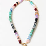 A necklace with a variety of colored beads and a gold-tone toggle clasp.
