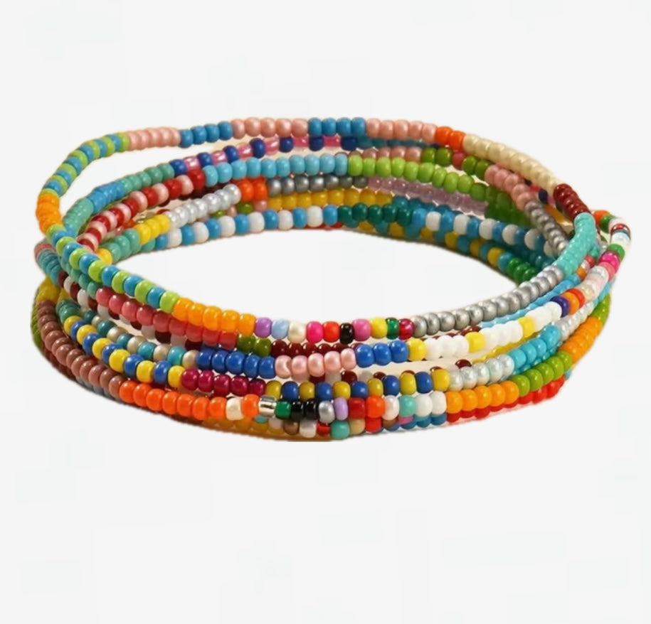Set of 7 colorful stretch beaded bracelets on a white background