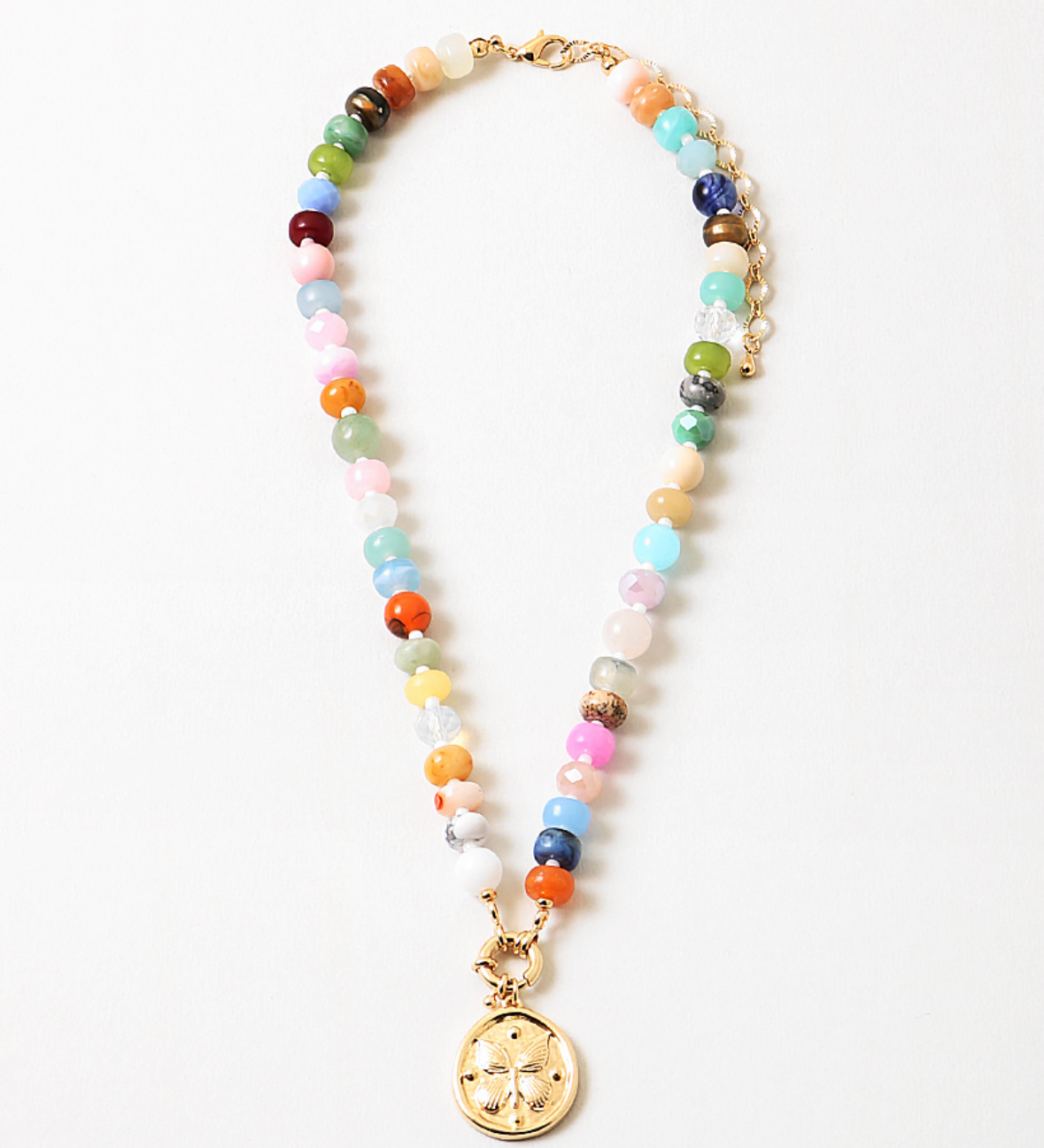 Multicolor bead necklace with a large central clasp and a butterfly disc pendant.