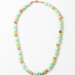 Bead necklace in white, greens, yellows and beige.