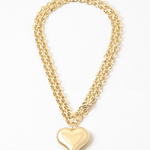 A double gold chain necklace with a gold Puffy heart pendant.