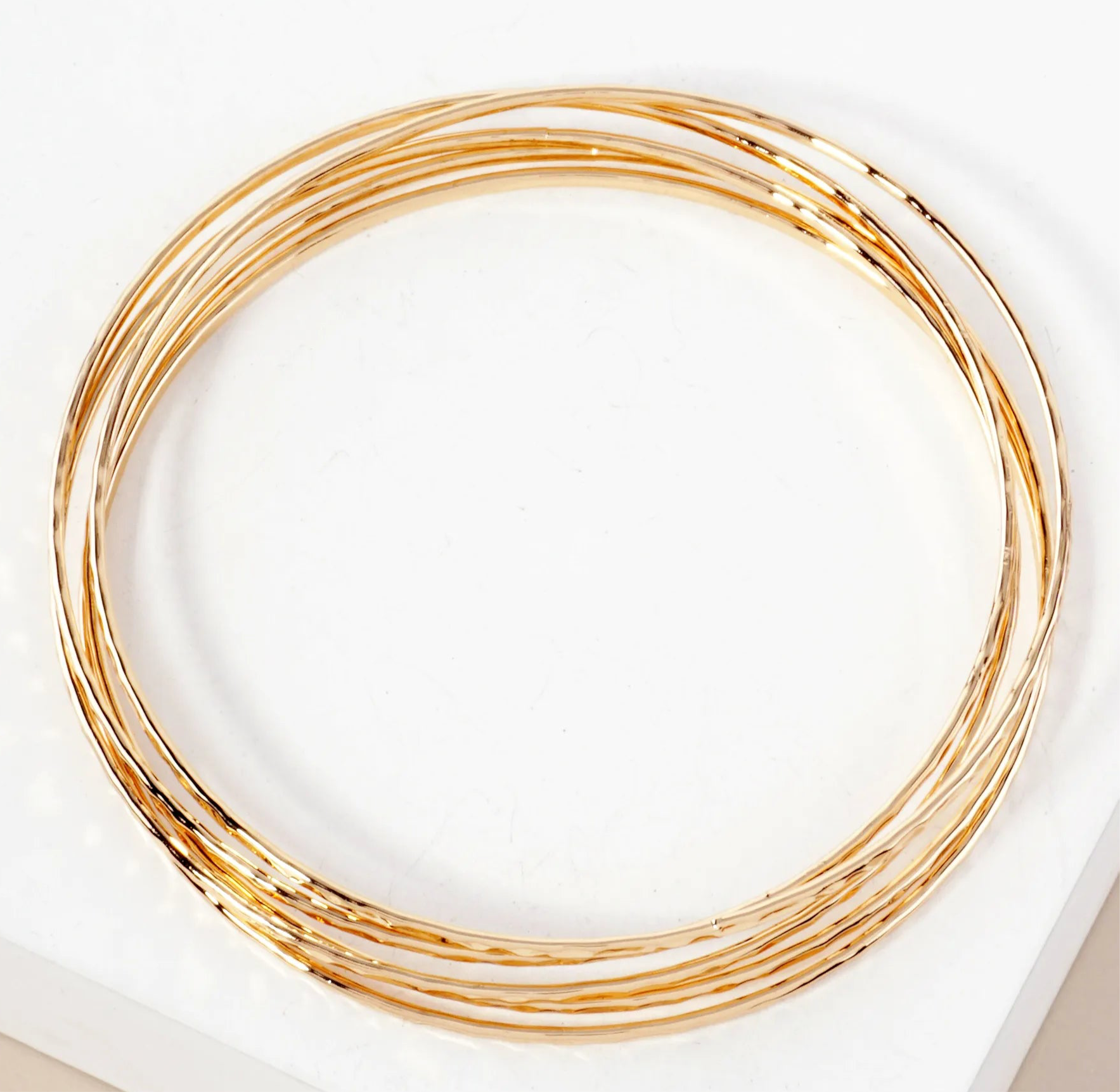 Set of five fine gold bangles