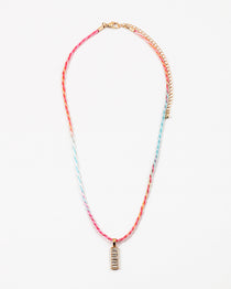 Necklace with colorful cord and gold rectangle pendant on a white background