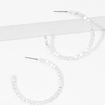 Picture of a set of white bead hoop earrings.