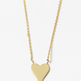 Gold heart-shaped pendant on a delicate gold necklace on a white background