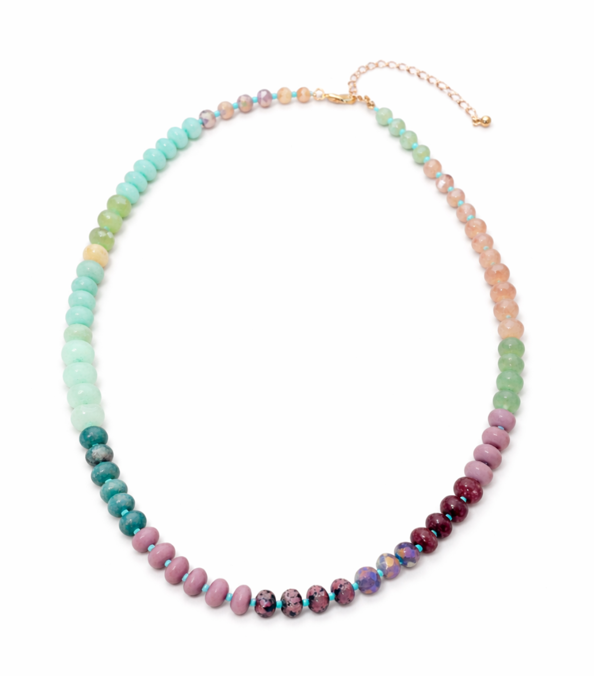 Multicolored green, pink and coral beaded necklace on a white background