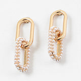 Set of gold chain link earrings. Bottom link is covered in pearls.