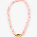 Light pink bead necklace with large gold carabiner clasp.