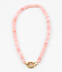Light pink bead necklace with large gold carabiner clasp.