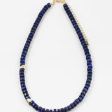 Navy bead necklace with two gold accent spacers beads.