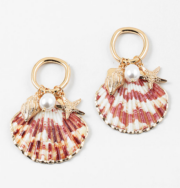 Set of half shell earrings with gold tipped edges. Earrings hang from small gold hoops with three small pendants dangling from them. One is a small golden conch, a golden starfish and a small fresh water pearl.