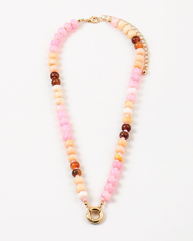 Beaded necklace with pink, orange, and brown beads with a gold clasp on a white background