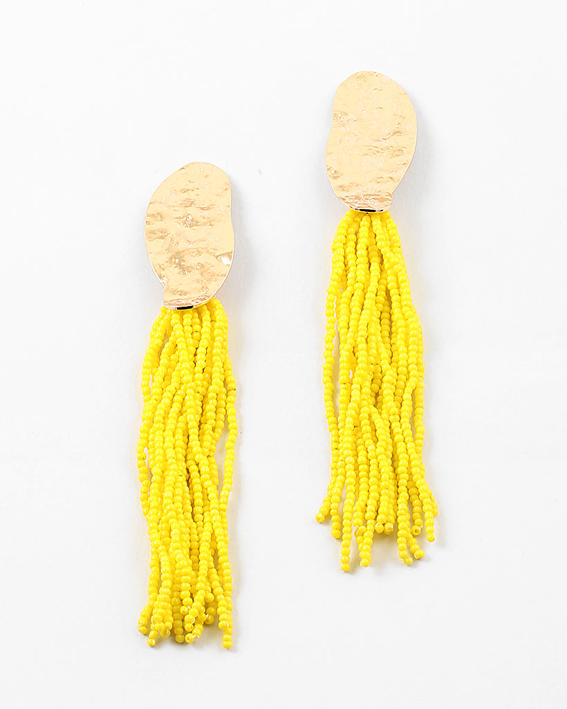 Picture of gold hammered ovals with many  strands of yellow seed beads.