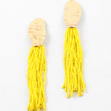 Picture of gold hammered ovals with many  strands of yellow seed beads.