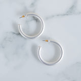 Picture of white silver hoop earrings.