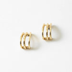 Pair of gold hoop earrings on a white background
