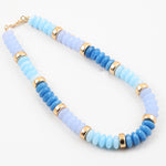 Chunky bead necklace in hues of opaque blues and gold spacer beads.