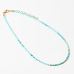 Delicate turquoise beaded necklace with gold accent beads.