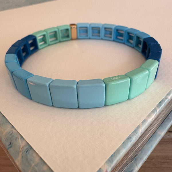 Square bead bracelet in ombre shades of muted blues.
