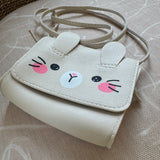 Picture of a little girl's purse. Purse is made to look like a sparkly cream colored bunny face.
