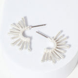 Set of silver starburst hoops.