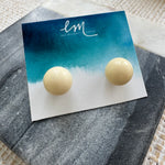 Picture of cream colored sphere studs.