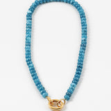 A marbled blue bead necklace with a gold carabiner clasp.